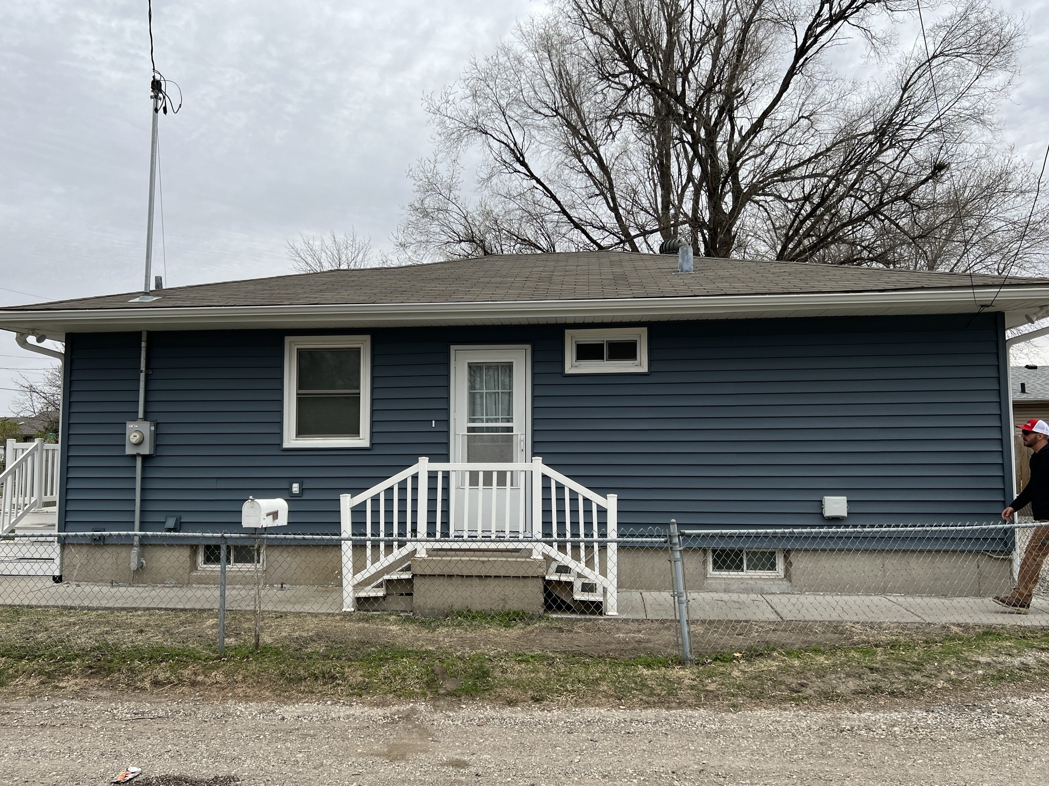 Blue vinyl siding and white trim on an Alfa Y Omega project