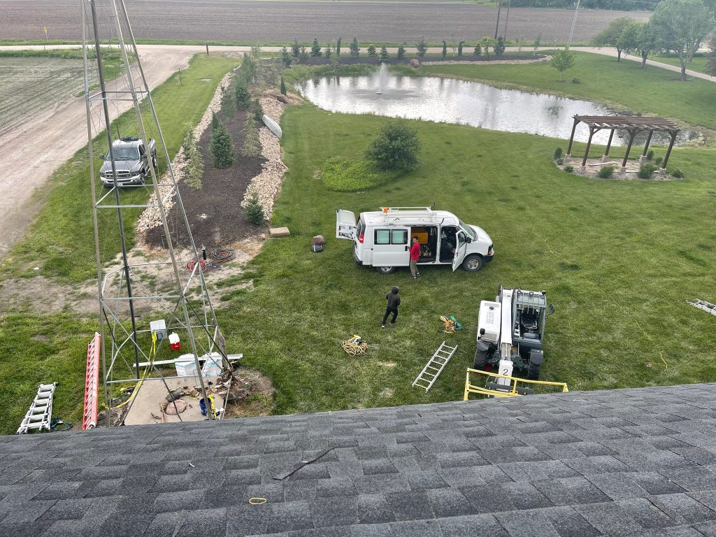 View from a barn roof over the work area and surrounding property.