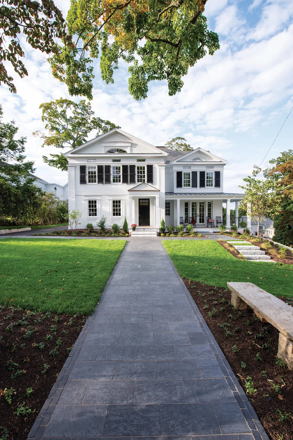 Finished white home with LP SmartSide lap siding and black shutters. Manufacturer inspiration.